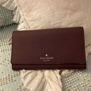 kate spade saffiano leather continental wallet in deep burgundy